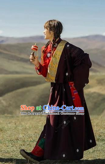 China Traditional Xizang Minority Young Lady Wine Red Tibetan Robe Zang Nationality Folk Dance Clothing